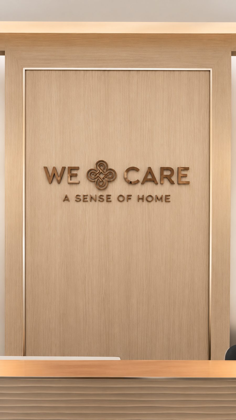 ป้ายโลโก้ We Care บนผนังไม้